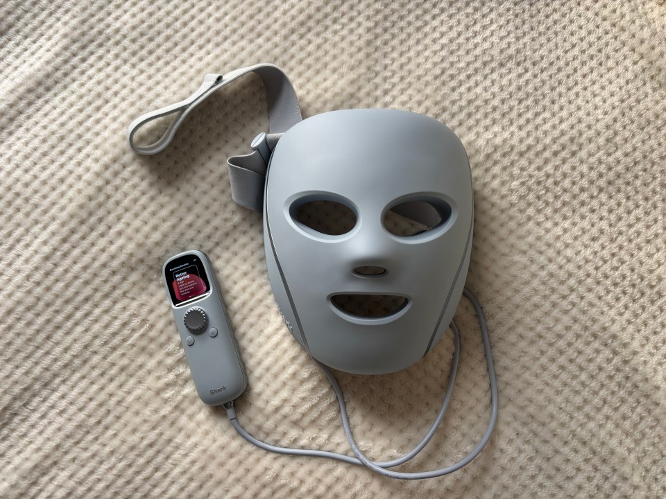 LED face mask with controller.