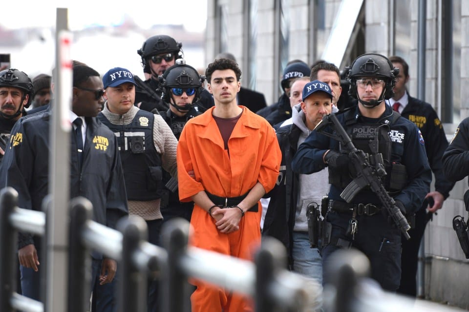 Luigi Mangione is escorted by police after being charged over the murder of United Healthcare CEO Brian Thompson