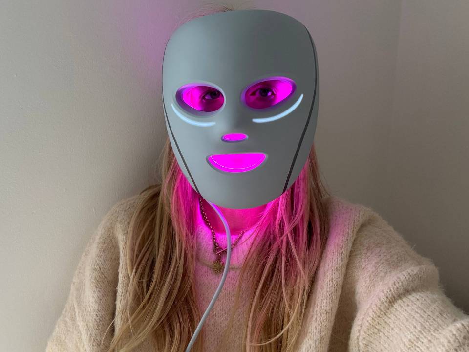 Person wearing a light-therapy mask.