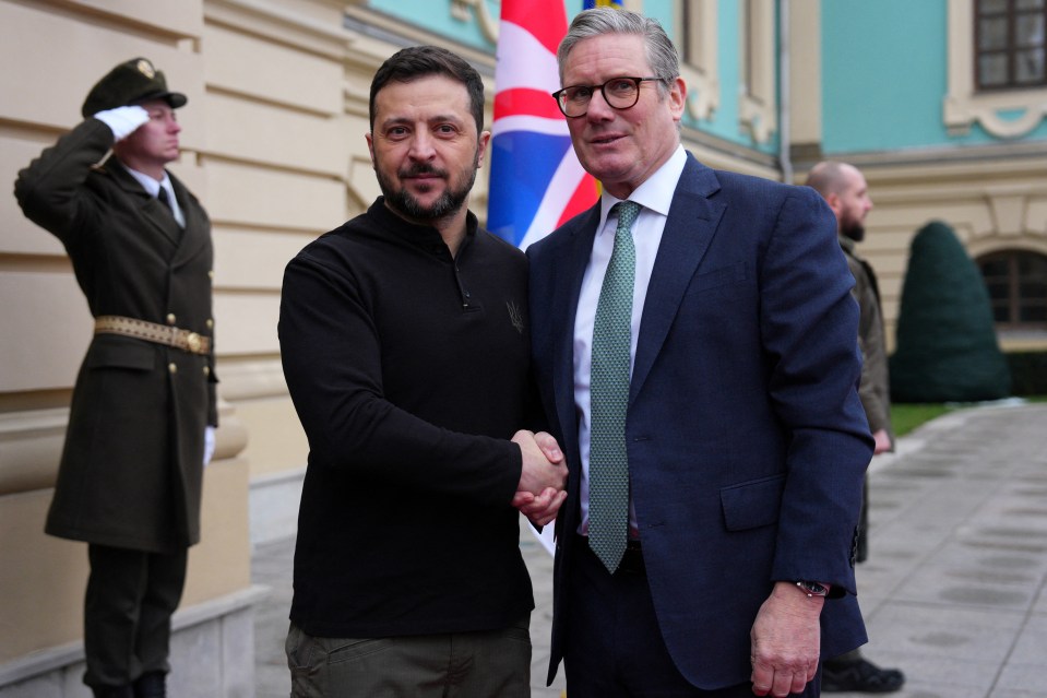 Keir Starmer and Volodymyr Zelensky shaking hands.